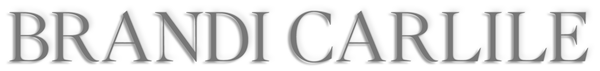 Brandi Carlile name logo in gray serif font with a subtle shadow effect.