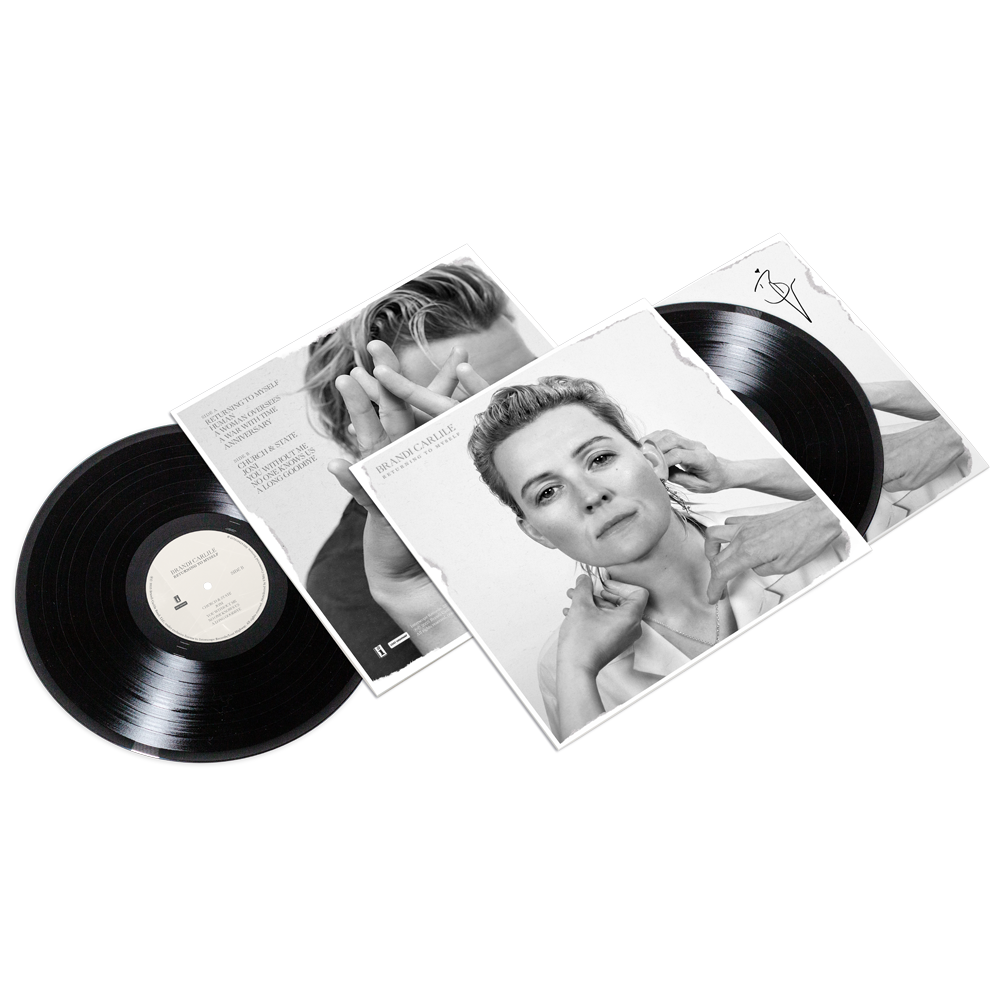 Vinyl records with a cover Brandi Carlile's face on a white background, along with an autographed album photo. 